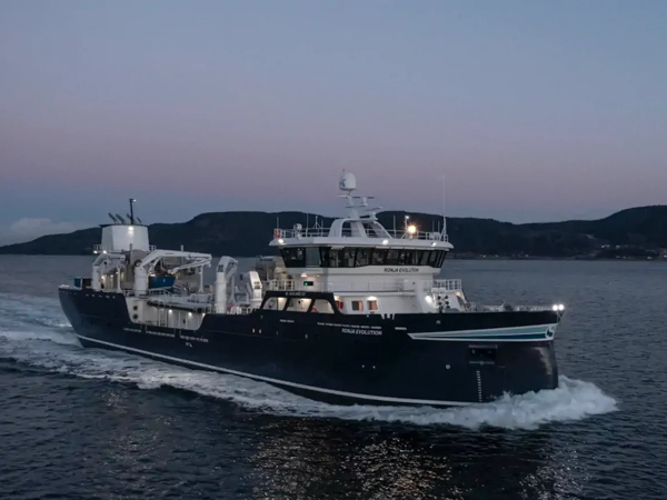 The live fish carrier Ronja Evolution underway at sea during twilight.